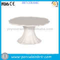 White ceramic fluted decorative caked plates with scalloped edge